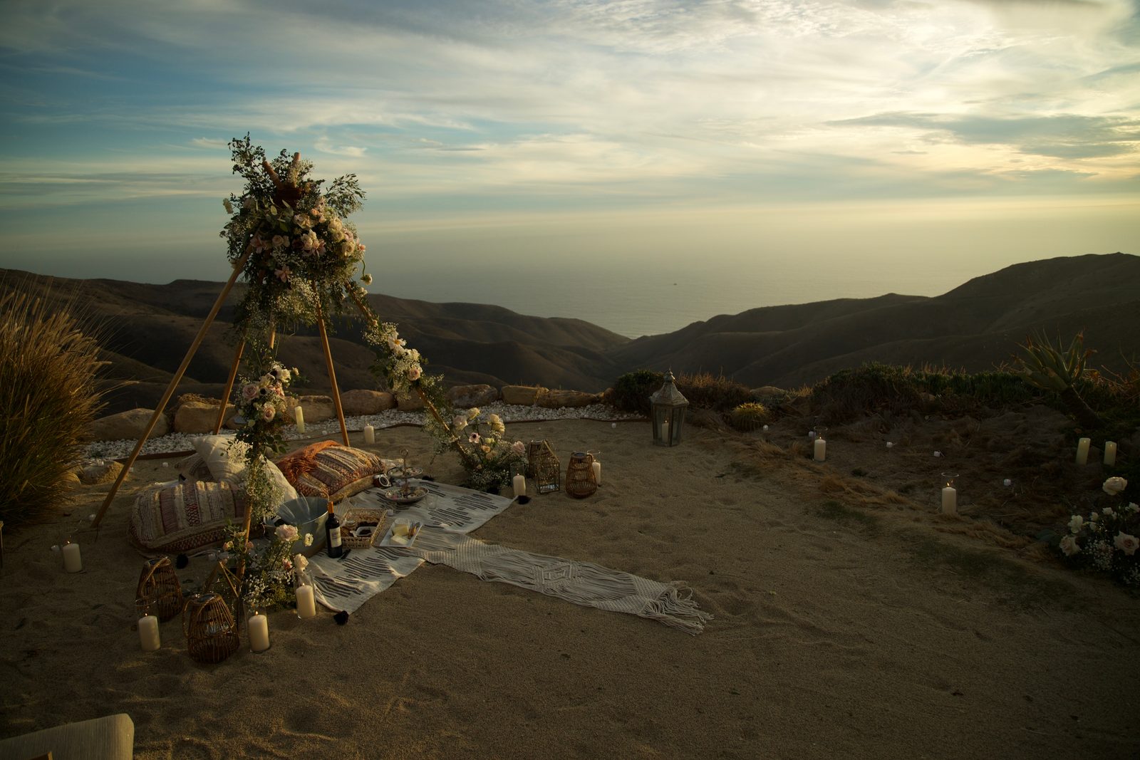 Floral teepee arch on a Malibu clifftop